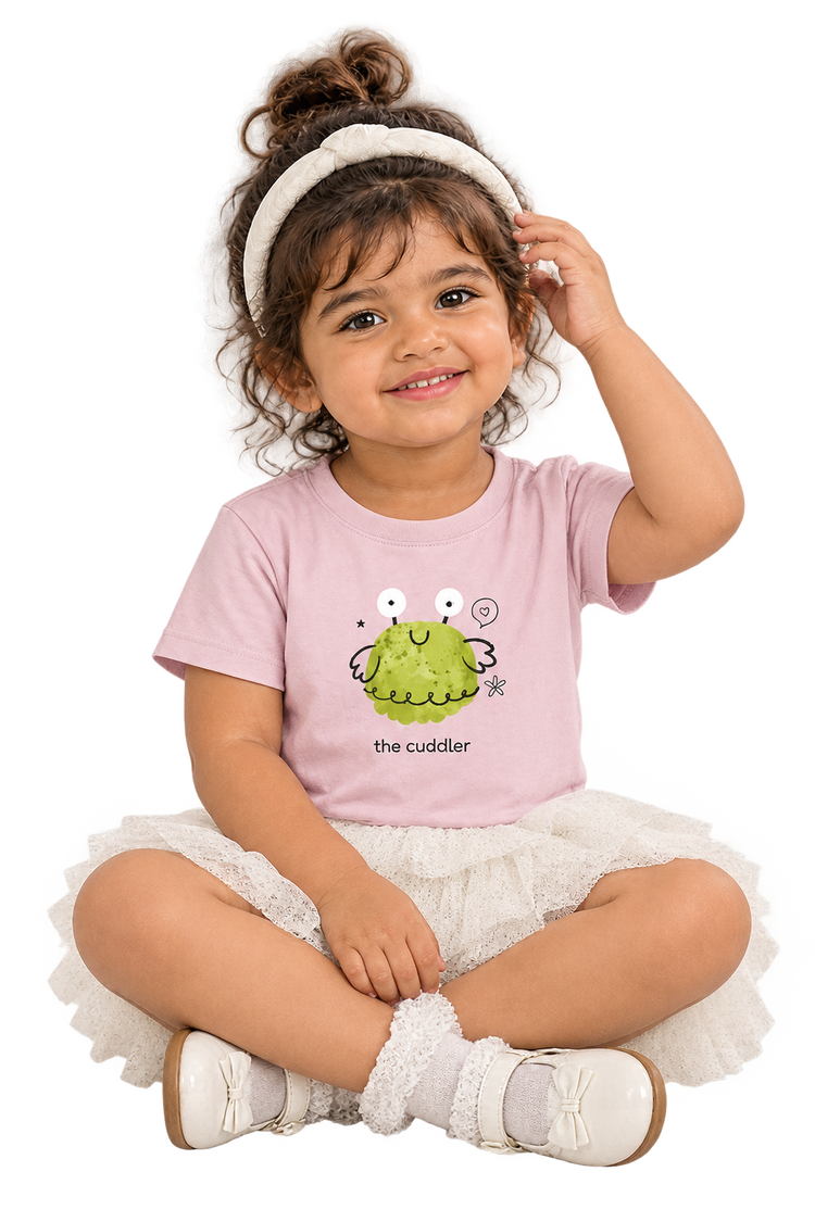 Anaya cross-legged close-up in The cuddler tee
