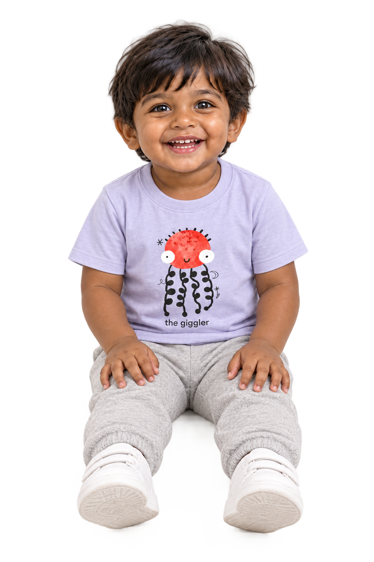 Dev seated giggling, The giggler